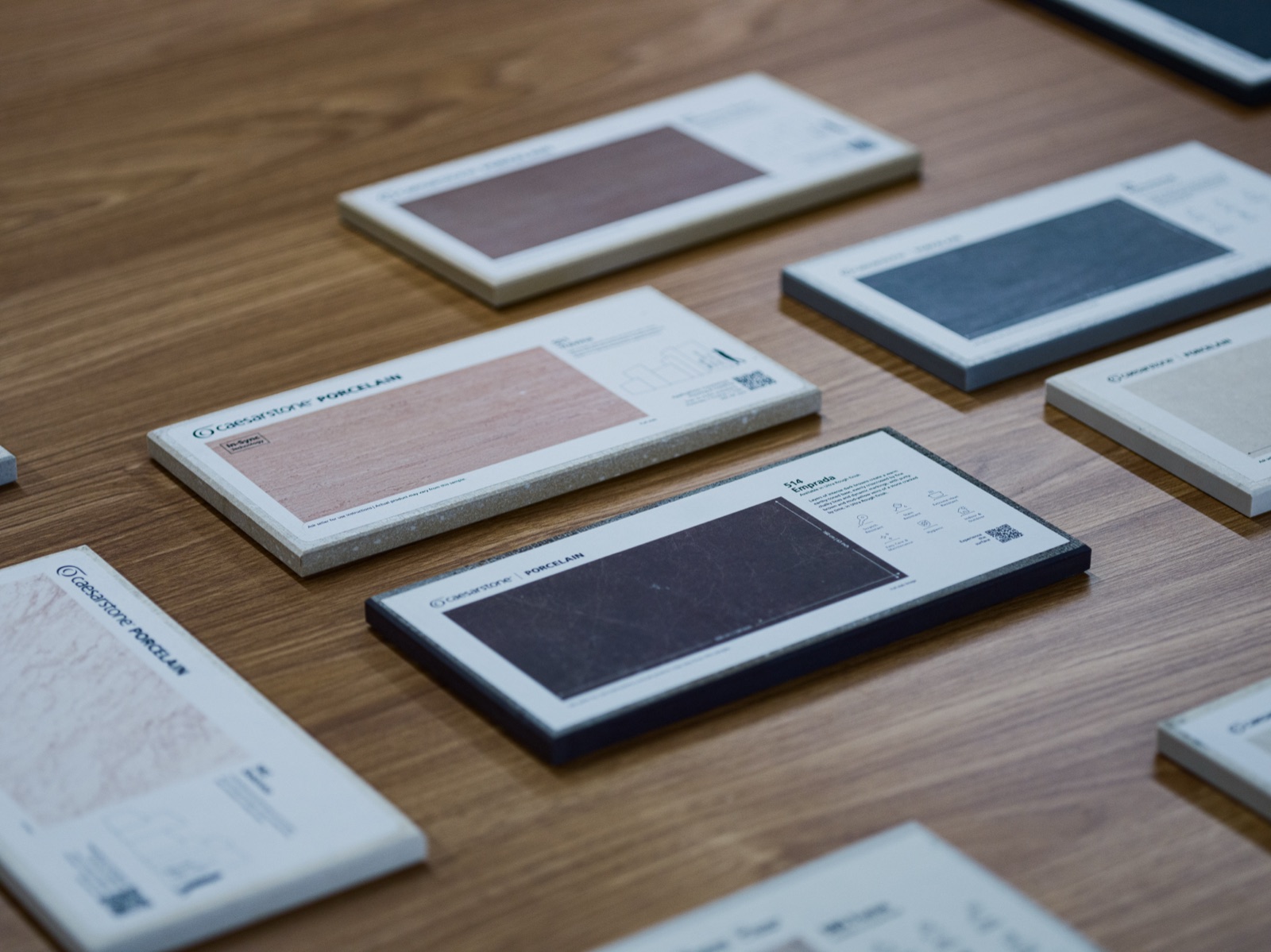 Caesarstone porcelain samples laid out on the showroom table